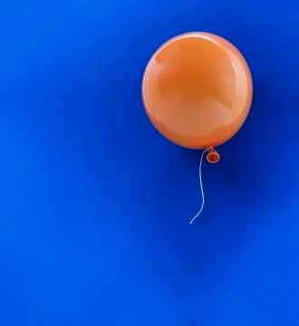 Orange Balloon on Blue Stock Photos