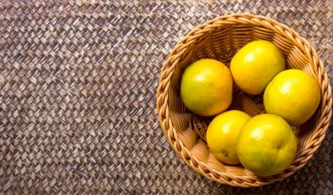 Orange in the basket on a beautiful background. Stock Photos