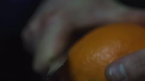 Orange being peeled in close up Stock Footage