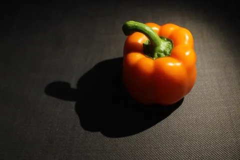 Orange bell pepper with big shadow Stock Photos