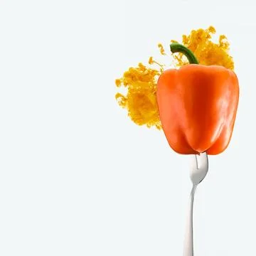 Orange bell pepper fork orange Stock Photos