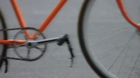 Orange bike passing Stock Footage 36779042