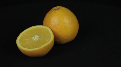 Orange on black background Stock Footage 35437965