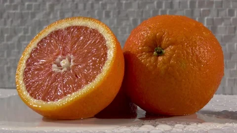 Orange on black background Stock Footage 159563229