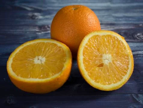 Orange on a black background Stock Photos