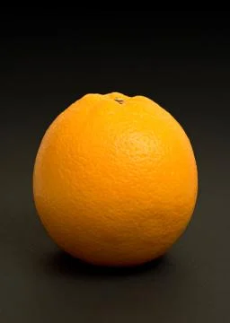 Orange on black Stock Photos
