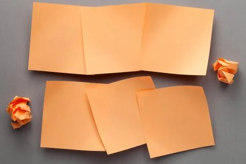 Orange Blank Paper Notes And Crumbled Paper Stock Photos