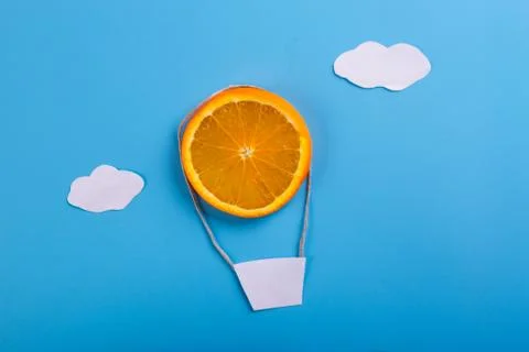 Orange on blue background Stock Photos