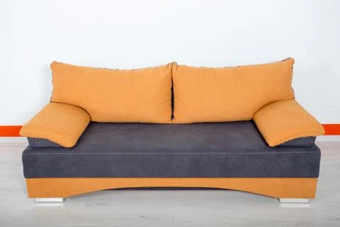Orange blue sofa on a white background Stock Photos