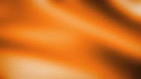 Orange blur gradient background with dark brown and beige grainy texture 4K.. Stock Photos