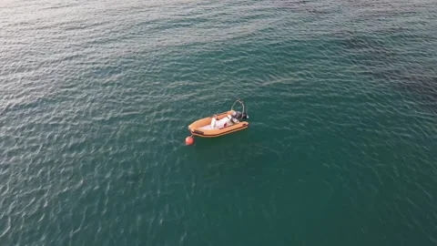 Orange Boat in the sea Video stock 149162182