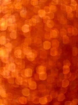Orange bokeh abstract background with circular light pattern Stock Photos