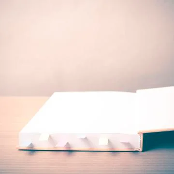 Orange book with sticky note Stock Photos