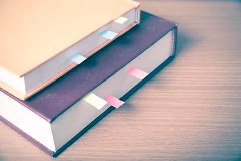 Orange book with sticky note Stock Photos