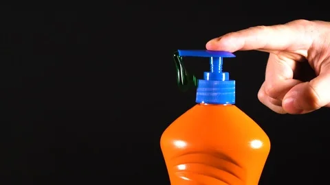 Orange bottle of detergent. Bottle without labels and name. Video stock 124659464