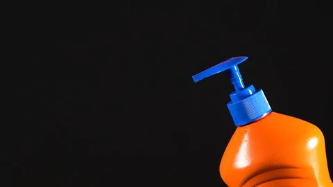 Orange bottle of detergent. Bottle without labels and name. Video stock 124659472