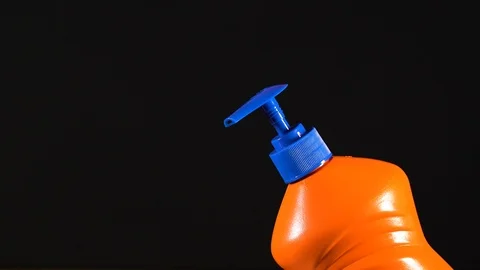 Orange bottle of detergent. Bottle without labels and name. Stock Footage 124659487