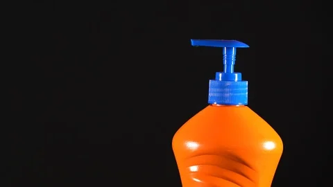 Orange bottle of detergent. Bottle without labels and name. Video stock 124659498