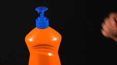 Orange bottle of detergent. Bottle without labels and name. Video stock 124659559