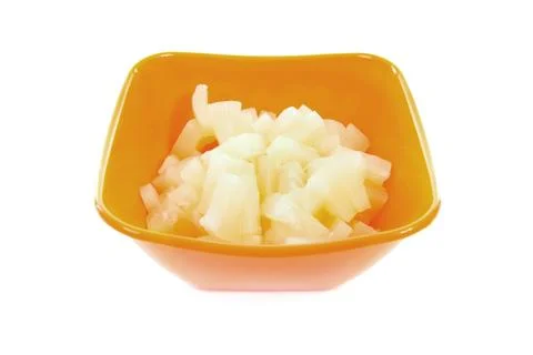 Orange bowl with diced pineapple Stock Photos