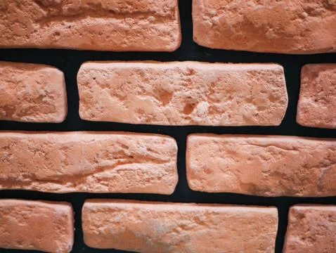 Orange brick facade. Torn stone texture. Stone wall. abstract background Foto stock