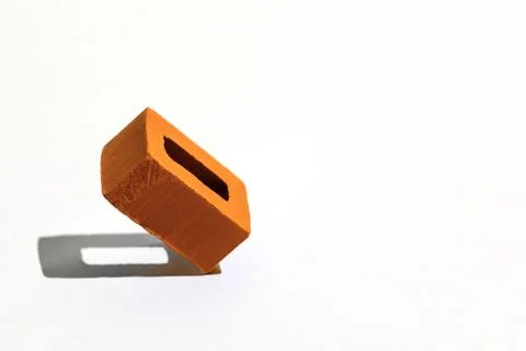 Orange brick on a light background. With a tight shadow Stockfoto's