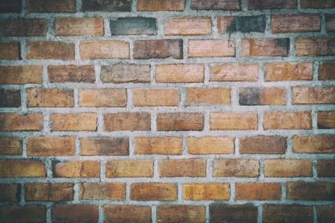 Orange brick wall abstract texture background backdrop Stock Photos