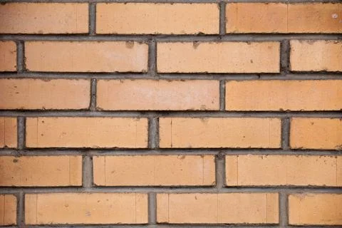 Orange brick wall background close up Stock Photos