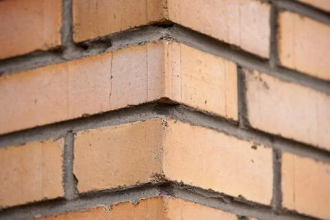 Orange brick wall background close up Stock Photos