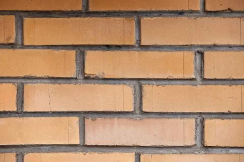 Orange brick wall background close up Stock Photos