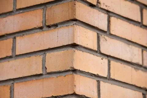 Orange brick wall background close up Stock Photos