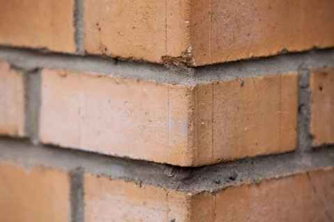 Orange brick wall background close up Stock Photos