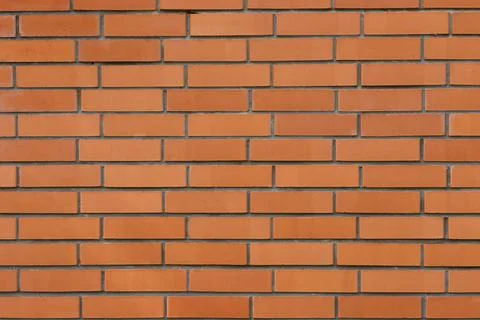 Orange brick wall background. Concept of template or wallpaper Stock Photos
