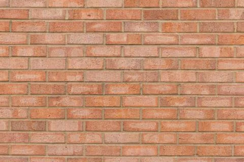Orange brick wall for a background. Stock Photos