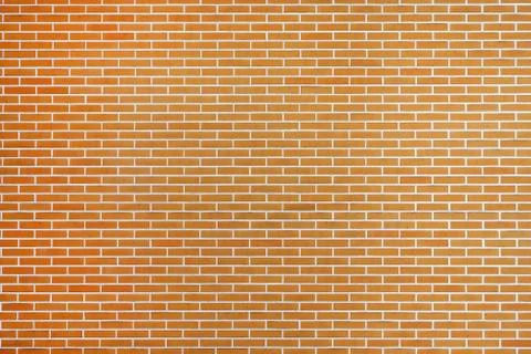 Orange brick wall background Stock Photos