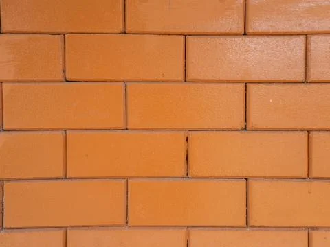 Orange brick wall background texture close up Stock Photos