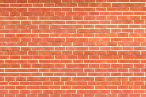 Orange brick wall for background use. Stock Photos