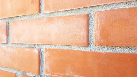 Orange brick wall. Close up perspective view. 写真素材