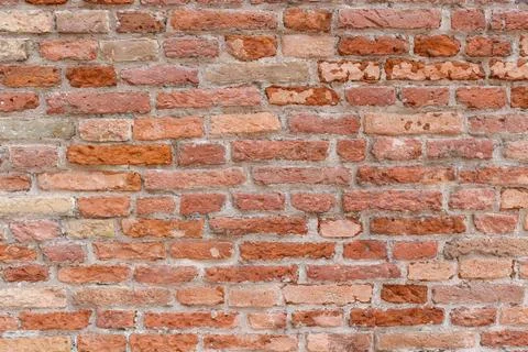 Orange brick wall close up Стоковые фото