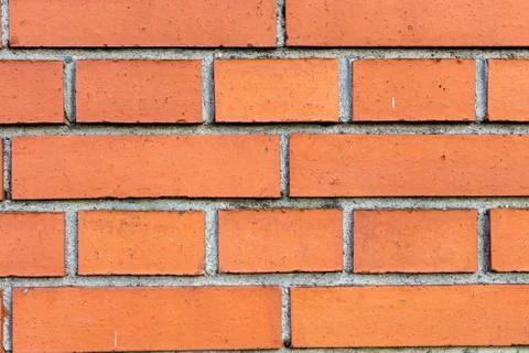 Orange brick wall close up structure construction design Stock Photos