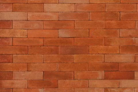 Orange brick wall for pattern and background Stock Photos