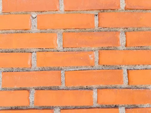 Orange brick wall pattern construction background Stock Photos