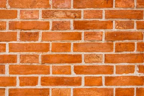 Orange brick wall Stock Photos
