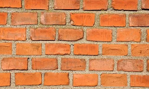 Orange brick wall Stock Photos