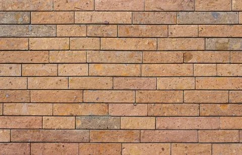 Orange brick wall, stone wall Stock Photos