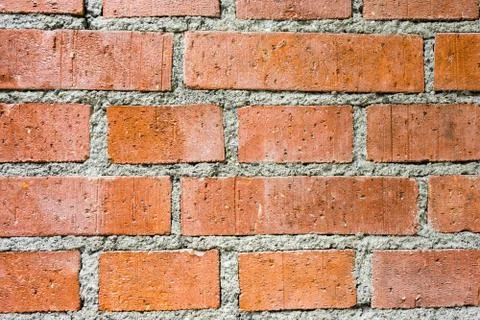 Orange brick wall structure Stock Photos