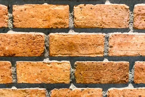 The   orange brick wall texture background. Stock Photos