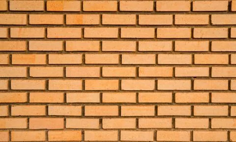 Orange brick wall texture background with space for text Stock Photos