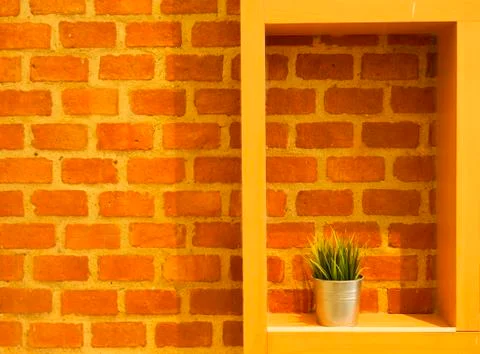 Orange brick wall texture background with wooden rectangle. Foto stock