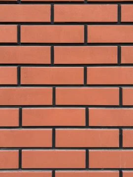 Orange brick wall texture background. Abstract pattern of masonry construction Stock Photos